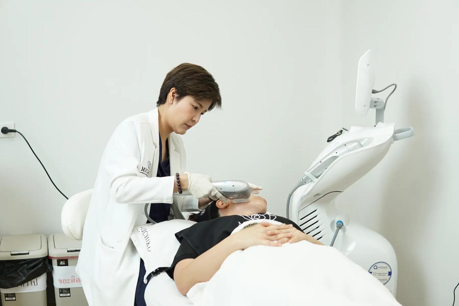 Dr. Gift performing a skin treatment at MICHIKO